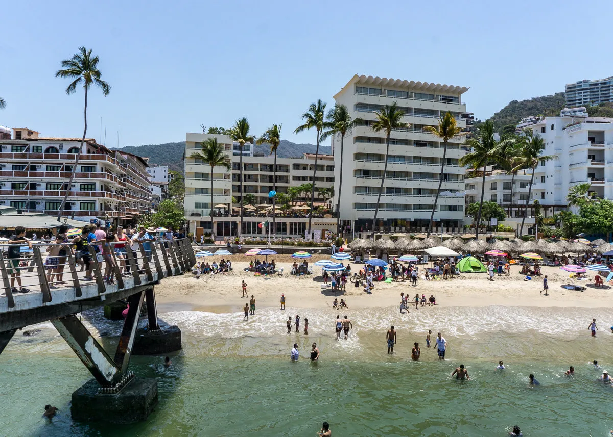 Playa Los Muertos with pier and umbrellas